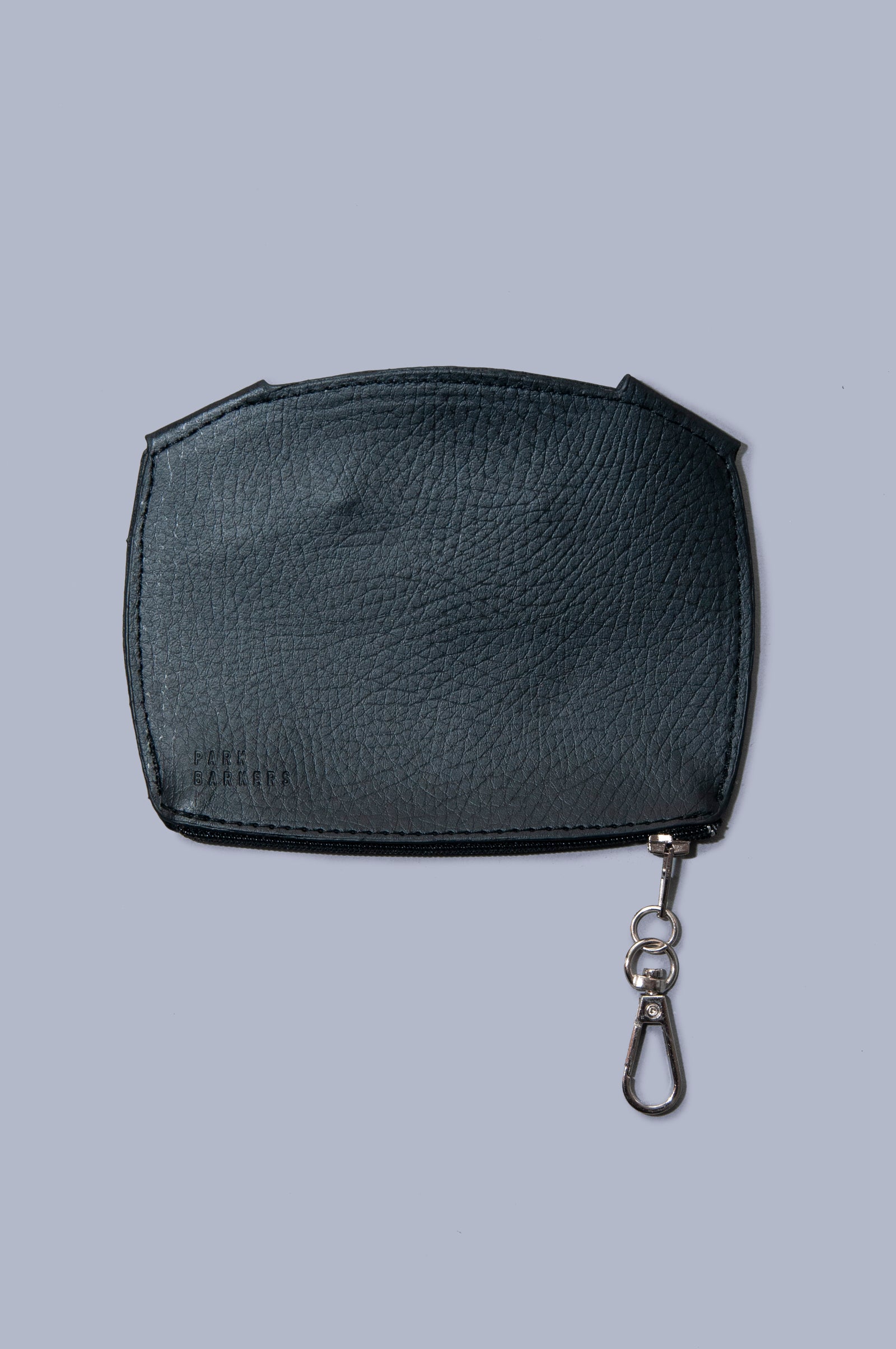 Front view of Boboli poo bag holder. Cute dog face shaped poo waste bag holder with dispenser hole at the mouth position on the front. Gold clasp doubles as wide zip feature at bottom of the bag holder